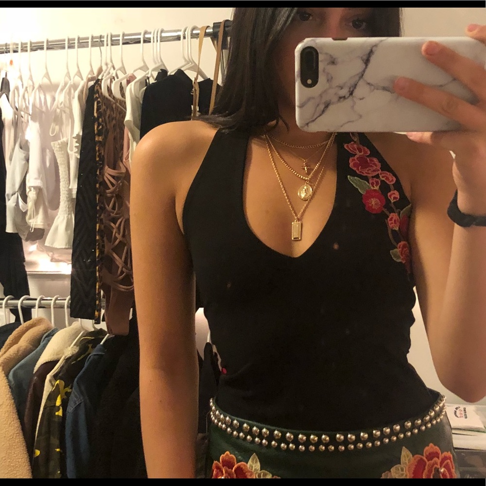 Black halter body suit with a rose design